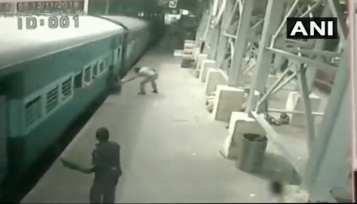 cop saves man from falling under train